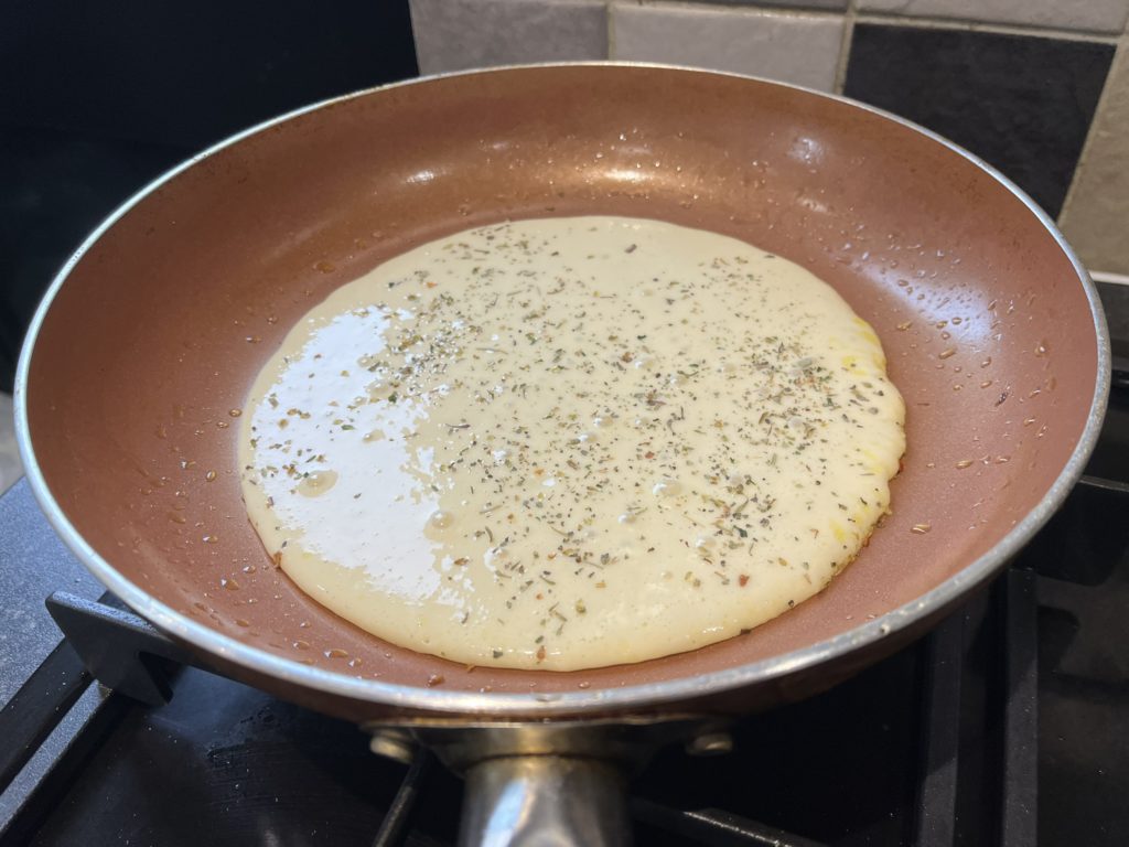 gluten free pancakes cooking in pan