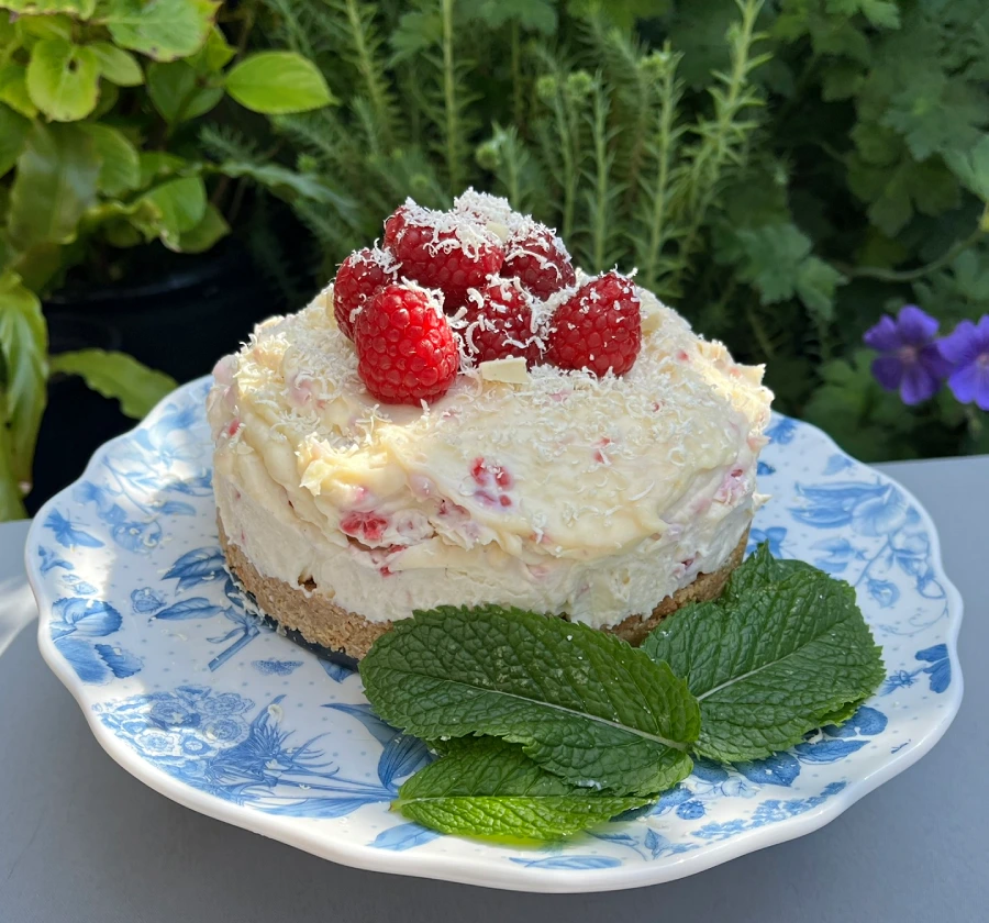 Gluten-Free Raspberry and White Chocolate Cheesecake on plate