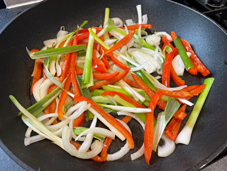 gluten-free teriyaki chicken stir frying more veg