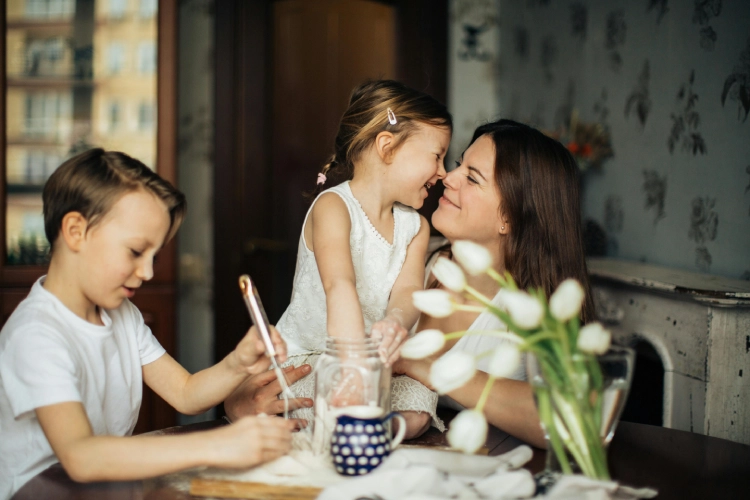 women with children at table