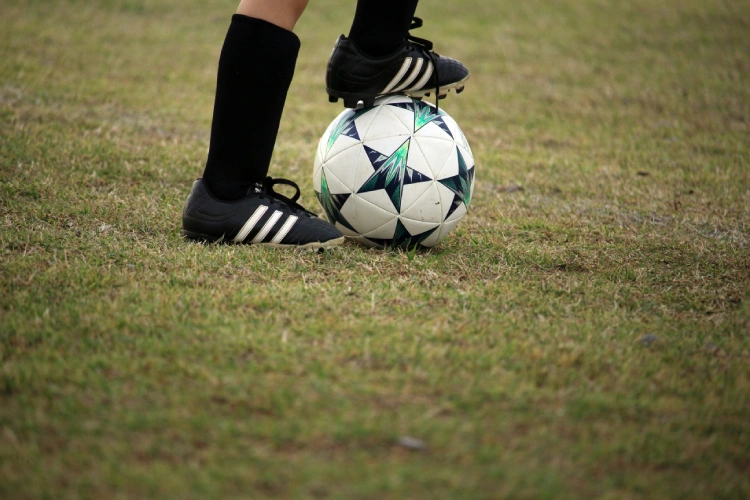 child playing football