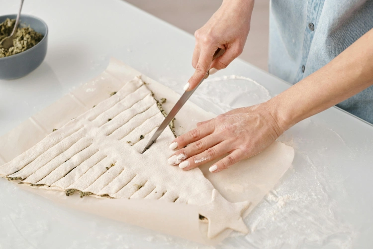woman cutting pastry